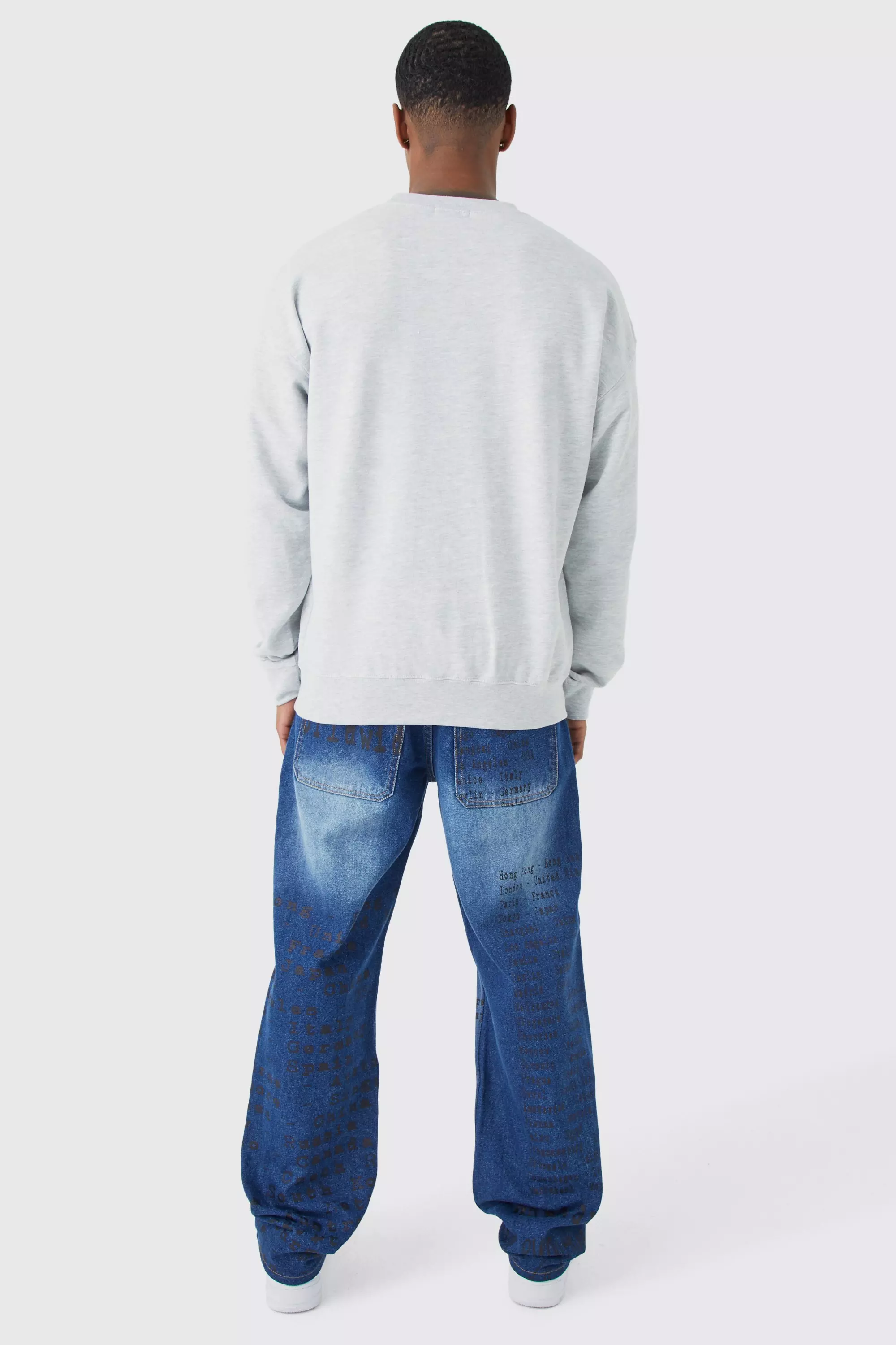 Relaxed Rigid All Over Text Laser Print Jeans | boohooMAN USA